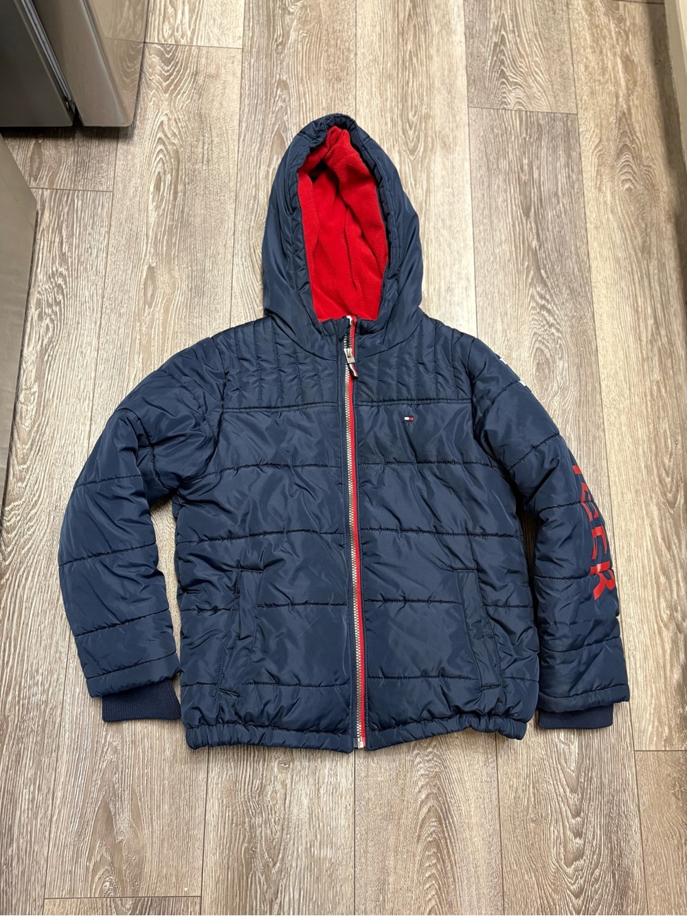 Tommy Hilfiger Navy Puffer Jacket with Red Hood Lining for kids